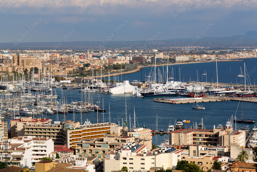 port with yachts and the city of Palma De Mallorca