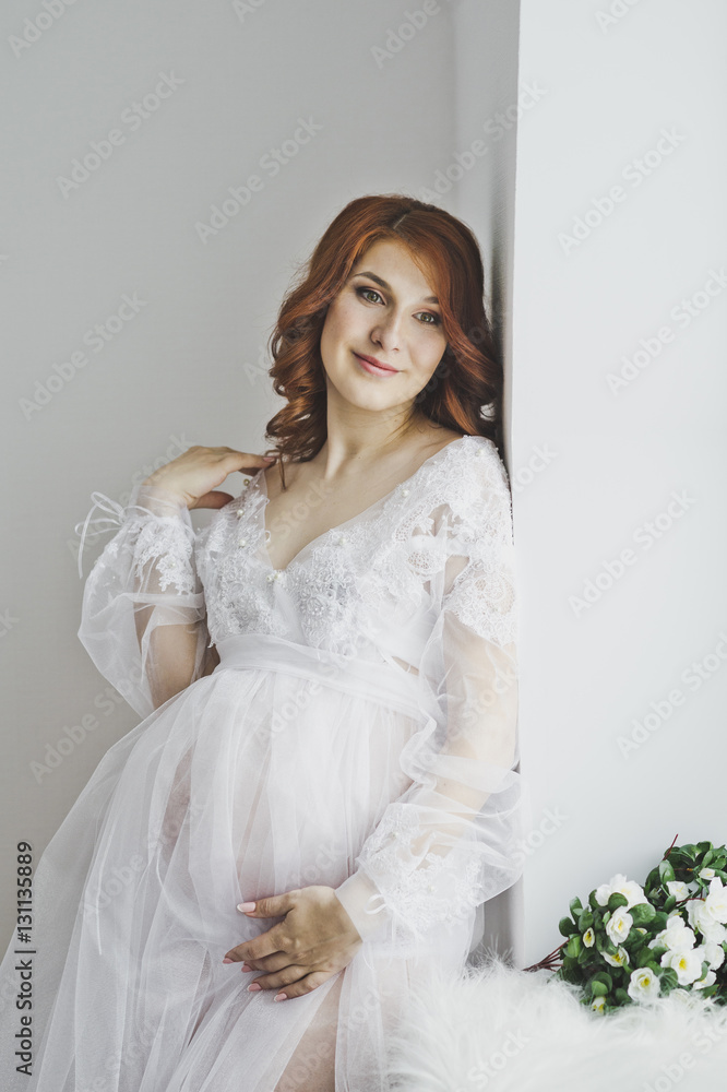 Gentle redhead girl standing at the window 6859. Gentle redhead girl standing at the window 6859.