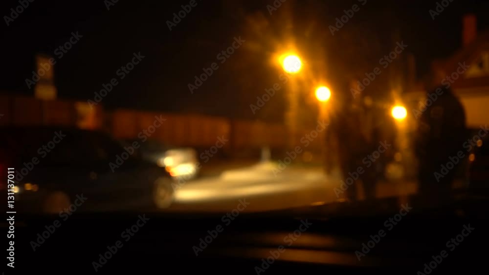 Night industrial zone, railway station full of trains. Shot from a car. Smoothed peoples, cars and railway carriage Night industrial zone, railway station full of trains. Shot from a car. Smoothed peoples, cars and railway carriage