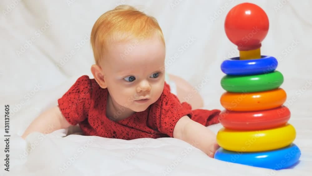 Little baby crawling and reaching for toy
Little baby crawling and reaching for toy