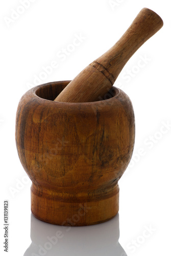Wooden mortar and pestle on a white background