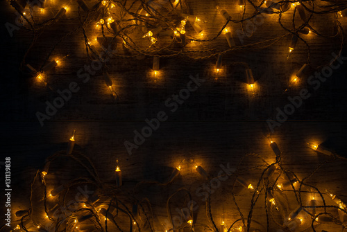 Christmas lights background concept on wooden desk.