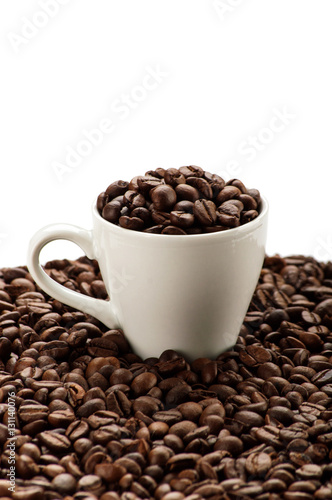 Cup in coffee beans