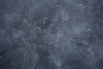 Dark stone or slate wall.