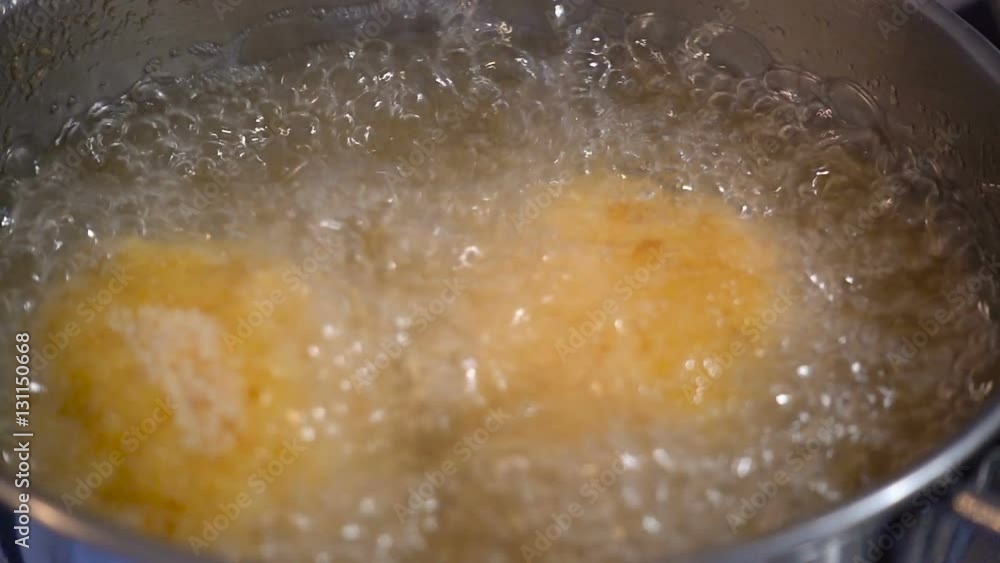 Home cooking of italian traditional dish arancini in slow motion Home cooking of italian traditional dish arancini in slow motion
