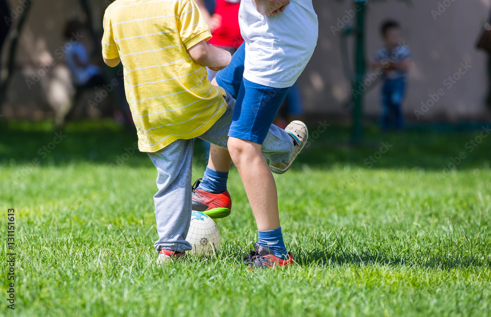 Football soccer match for children, kids playing soccer game Football soccer match for children, kids playing soccer game