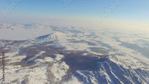 Russian Ural mountains in winter. Aerial view lake, white infinity photo