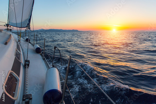 Sailing ship boats in the Sea during amazing sunset. Luxury yachts.