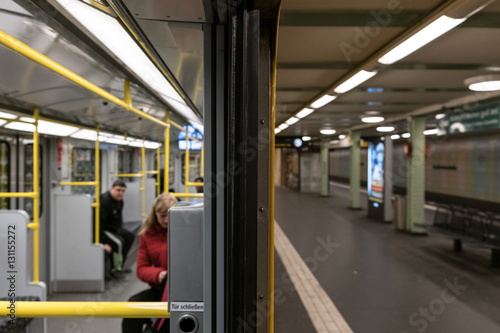 People in subway train (U-Bahn) at metro train station