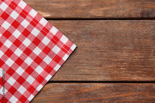 Red napkin on wooden table