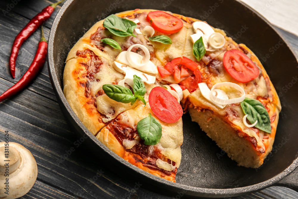 Freshly baked pizza in a pan