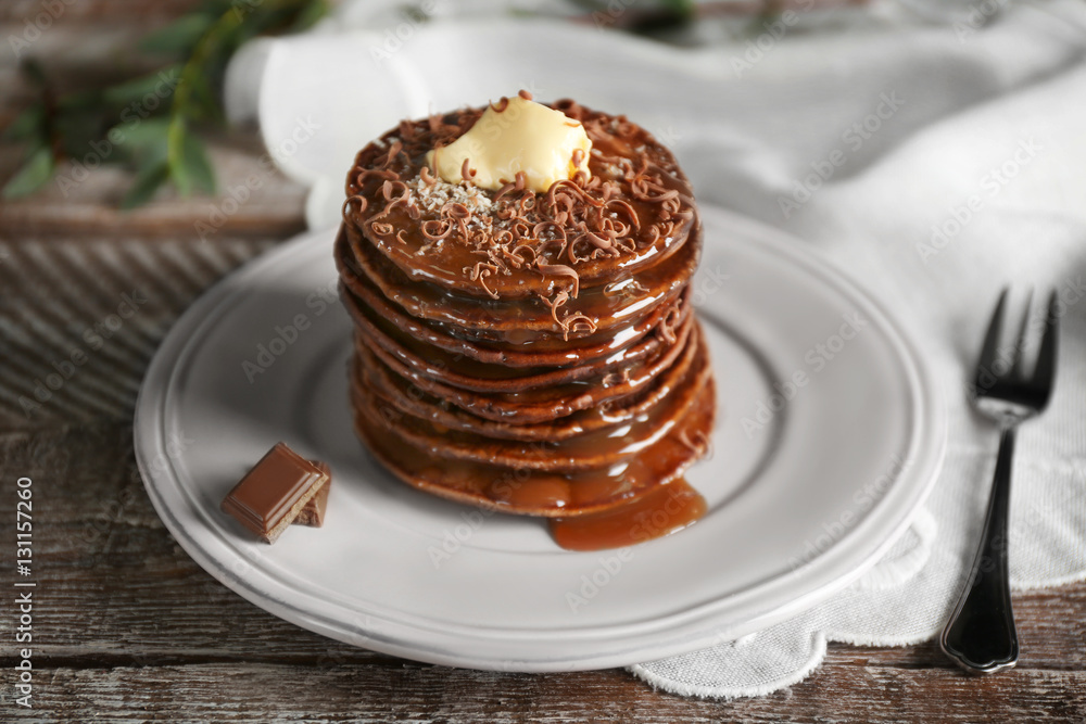Tasty pancakes with chocolate sauce on plate Tasty pancakes with chocolate sauce on plate