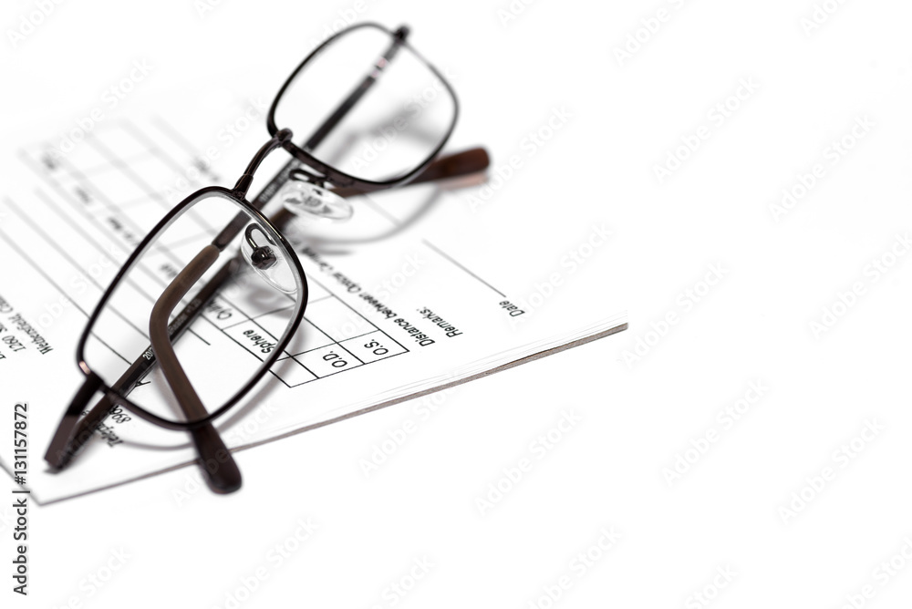 eye glasses on prescription pad