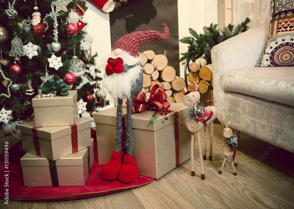 Obraz premium Christmas tree by the fireplace close up