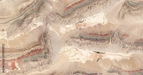 Wallpaper Mural High-altitude overflight aerial of thrust belt rock layers, Xinjiang province, China. Clip loops and is reversible. Elements of this image furnished by USGS/NASA Landsat Torontodigital.ca