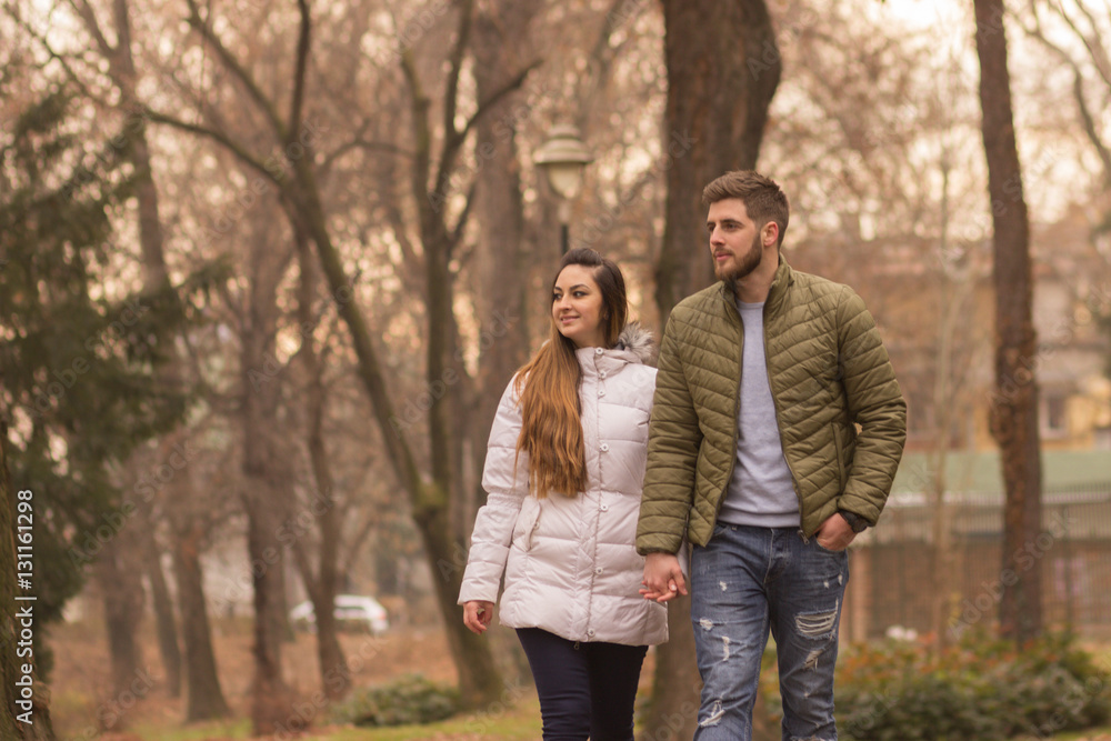 Young couple walking winter autumn day Young couple walking winter autumn day