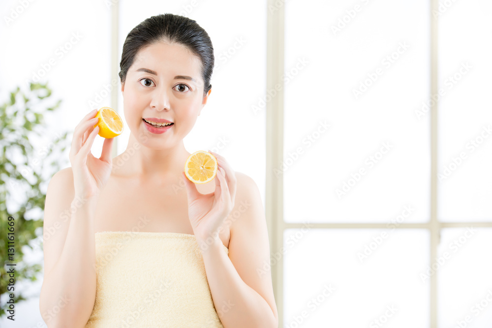 Beautiful asian woman holding slices of lemon. healthy beauty Beautiful asian woman holding slices of lemon. healthy beauty