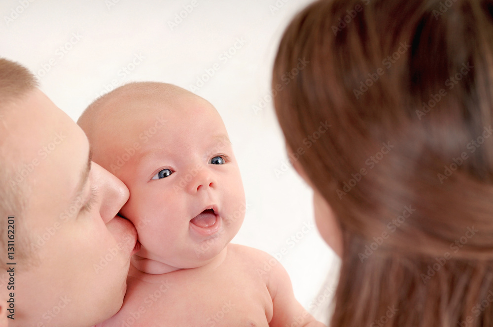 family portrait of father kissing her little cute baby family portrait of father kissing her little cute baby