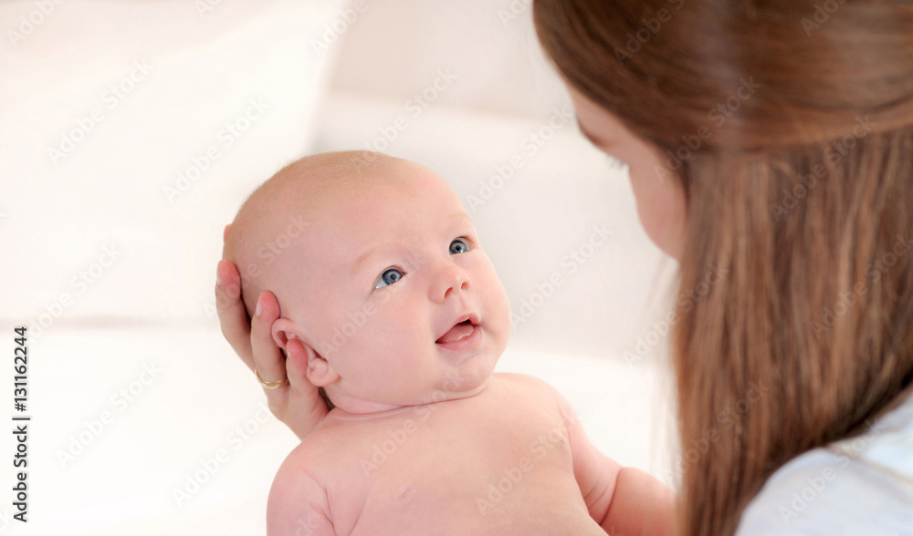 portrait of little cute baby looking at her mother portrait of little cute baby looking at her mother