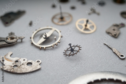 Detail of watch machinery on the table.