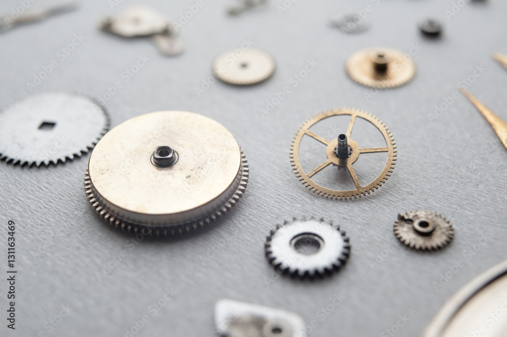 Detail of watch machinery on the table.