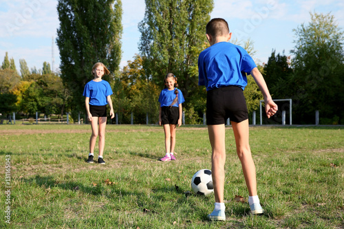 Cute kids playing football ...