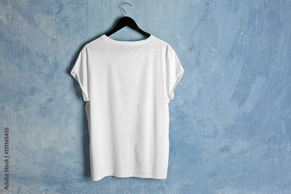 Blank white t-shirt on grunge background Stock Photo | Adobe Stock