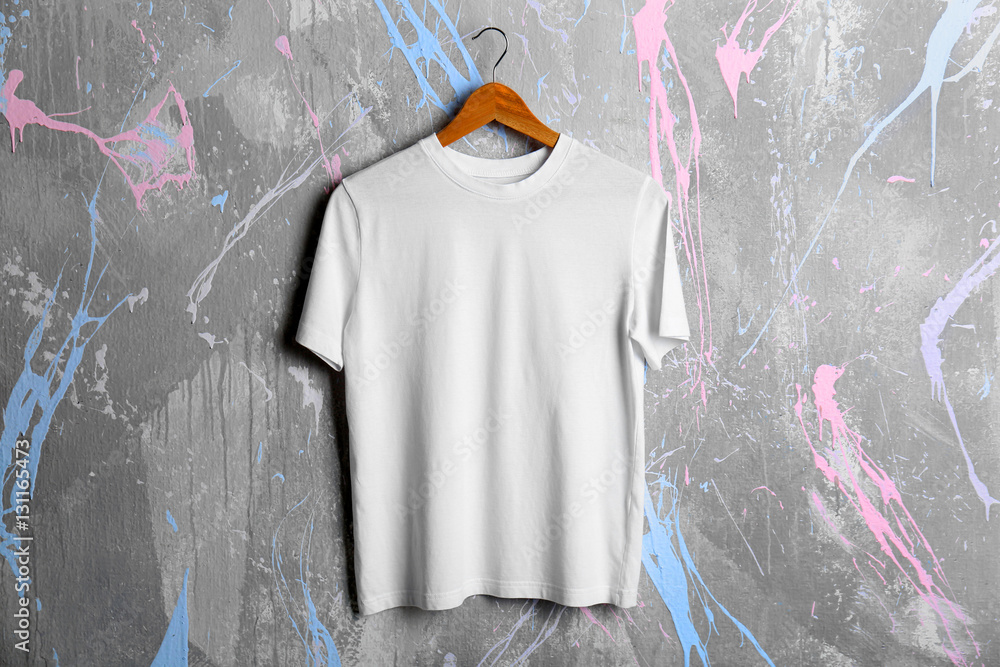 Blank white t-shirt on grunge background Stock Photo | Adobe Stock