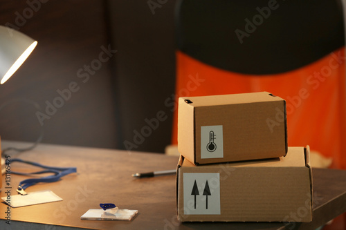 Carton boxes on table in room