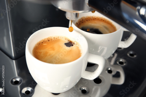 Closeup of making aromatic espresso in coffee machine