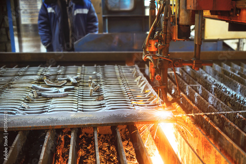 Oxygen torch cuts steel sheet.