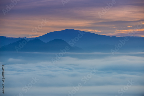 Sunrise and sea of clouds over Pai District Mae Hong Son, THAILAND. View from Yun Lai Viewpoint is located about 5 km to the West of Pai town centre above the Chinese Village.
