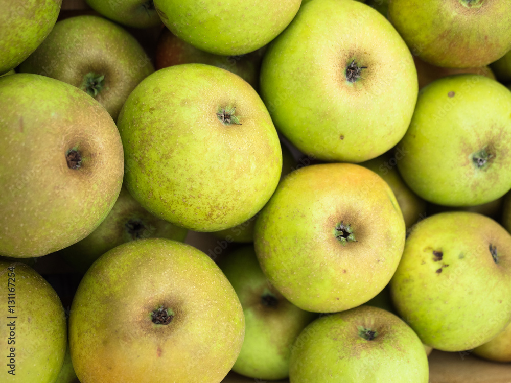 Background of green apples close up. Green apples pattern on sale at the market. Background of green apples close up. Green apples pattern on sale at the market.