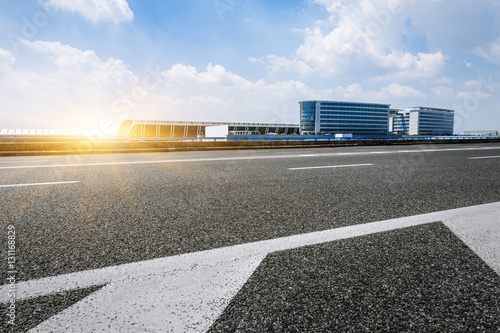 Foto Asphalt road at the airport at sunset