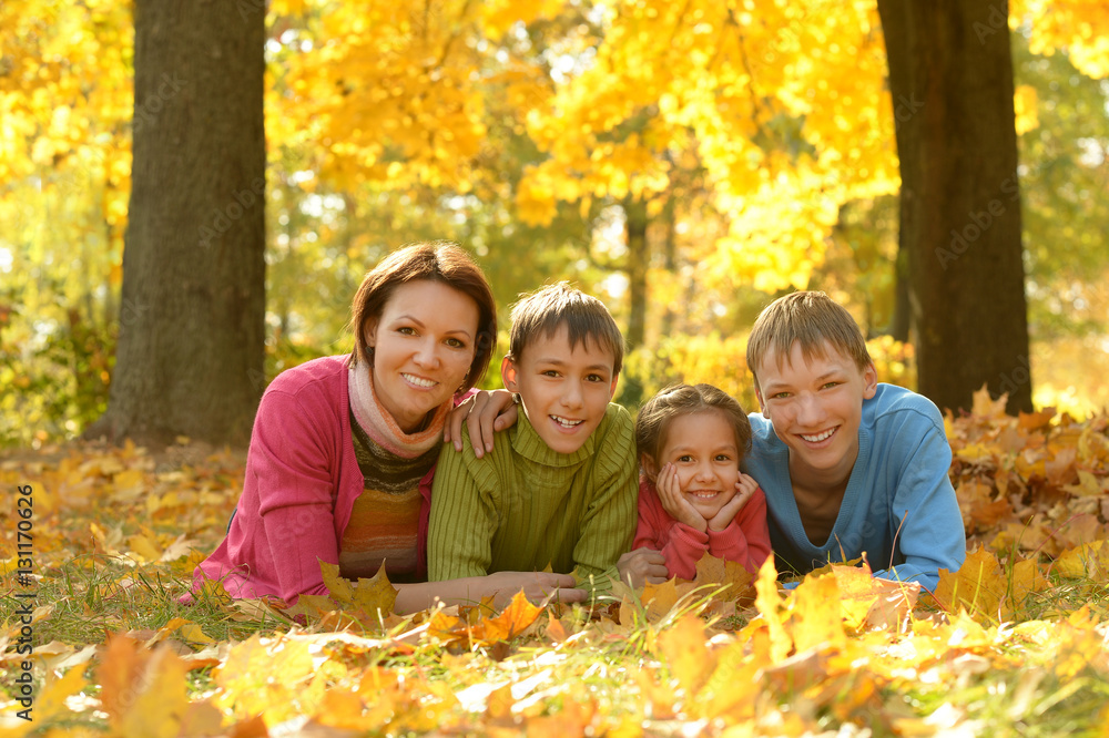 Family relaxing in autumn park Family relaxing in autumn park