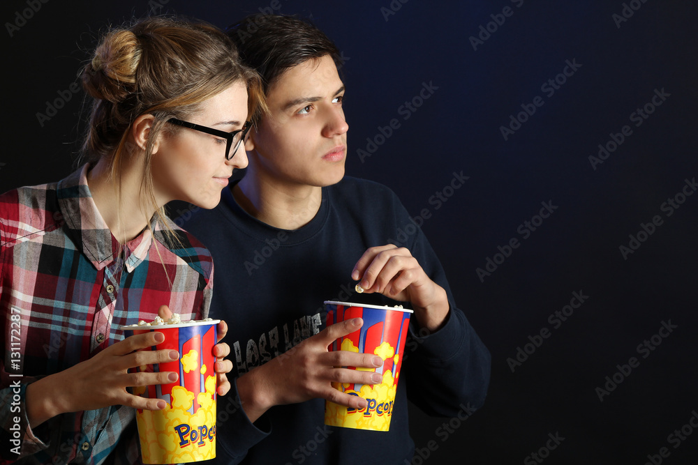 Young couple watching a movie in the cinema. Young couple watching a movie in the cinema.