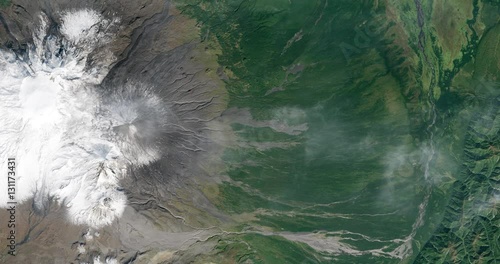 High-altitude overflight aerial of volcanic tundra, Kamchatka peninsula, Russia. Clip loops and is reversible. Elements of this image furnished by USGS/NASA Landsat