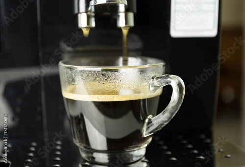 Making fresh coffee on espresso machine