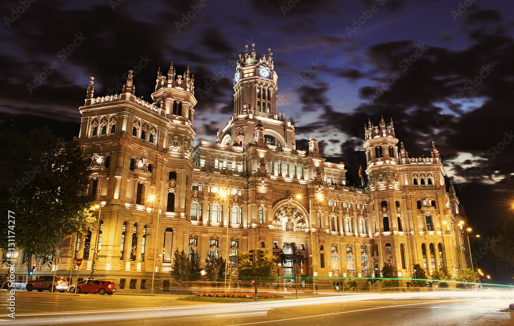 Cybele Palace at the Plaza de Cibeles with light trails of the traffic  night, Madrid, Spain