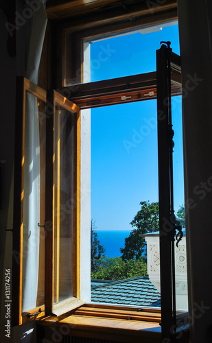 View from the open window on the sea landscape