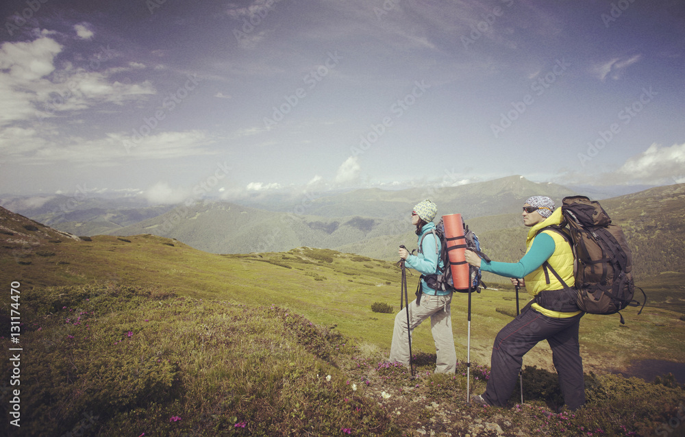 Fototapeta premium Man tourist walking the mountains with a backpack.