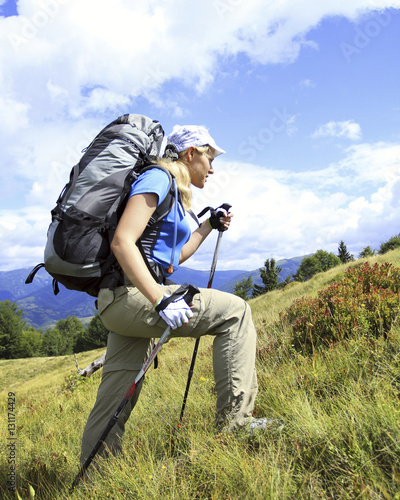 Man tourist walking the mountains with a backpack.