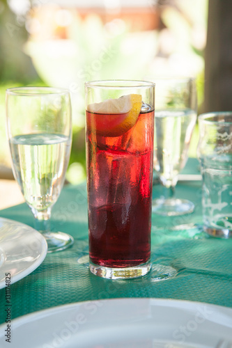 wine with soda tall glass on green tablecloth
