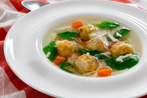 delicious wedding soup with meatball, carrots and spinach