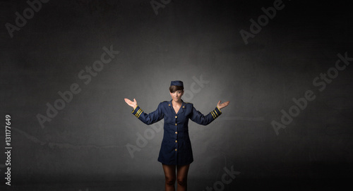 air hostess showing exit