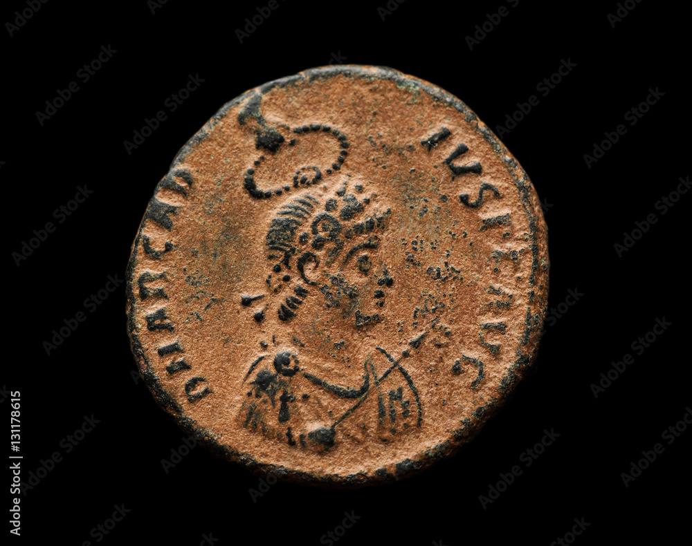 Ancient roman copper coin isolated on black Ancient roman copper coin isolated on black