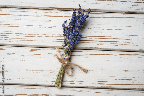 Fototapeta Naklejka Na Ścianę i Meble -  Bunch of lavender flowers on an old wooden table