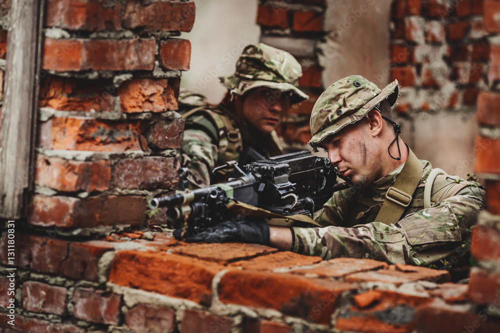 Fototapeta premium Army soldier during the military operation in the city. war, arm