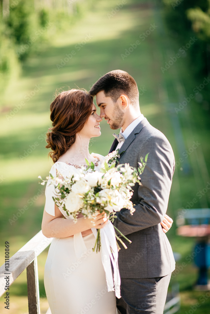 wedding couple hugging outdoors wedding couple hugging outdoors