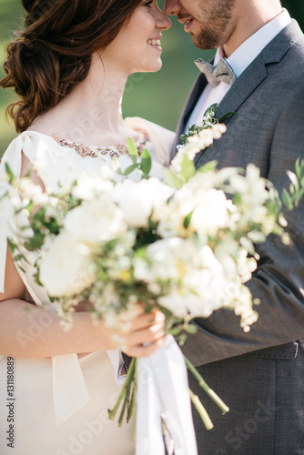 wedding couple hugging outdoors